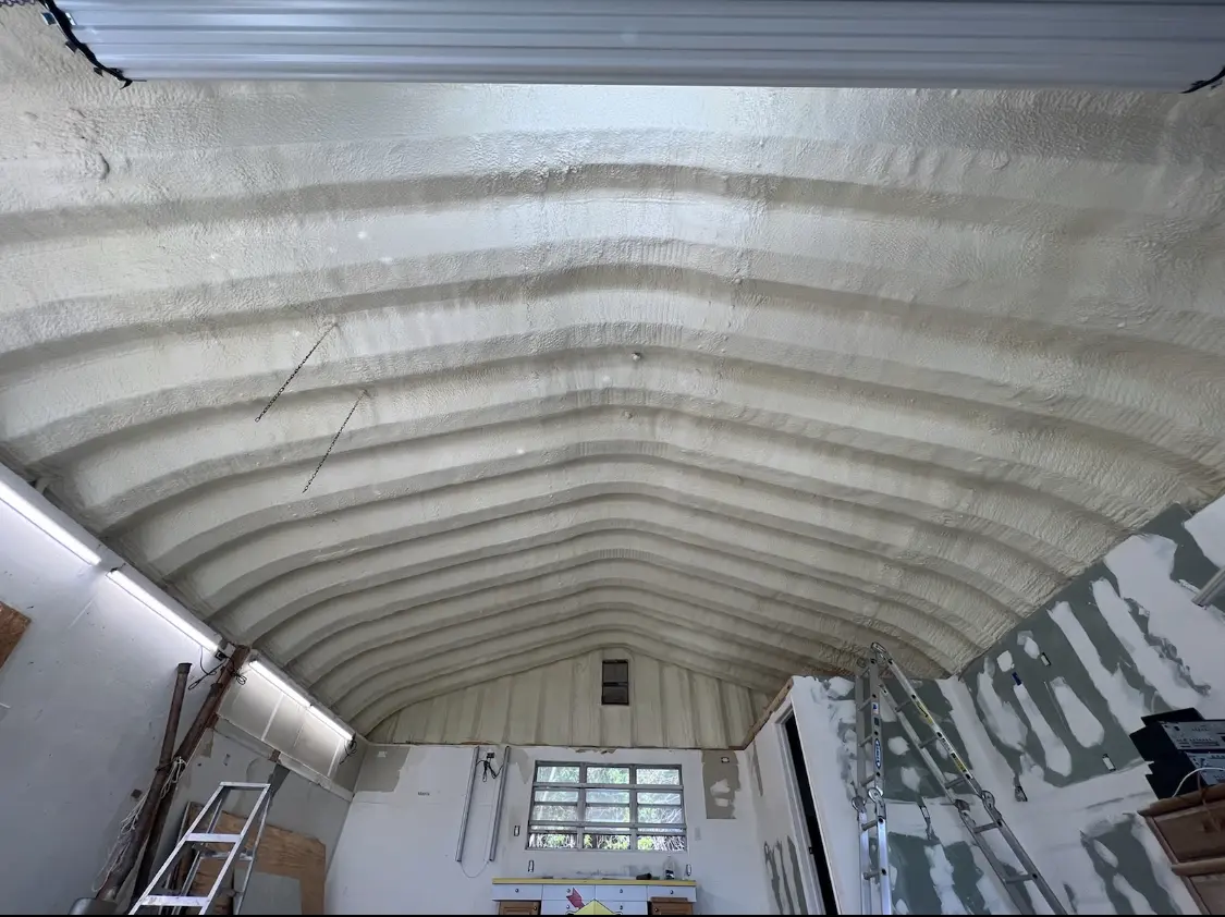 Spray polyurethane foam applied to the underside of a metal roof deck in Lakeland